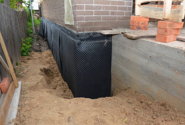 Happy homeowners after waterproofing job in Gulf Shores